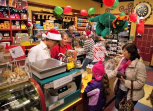 Kids in a candy shop checking out at the register.