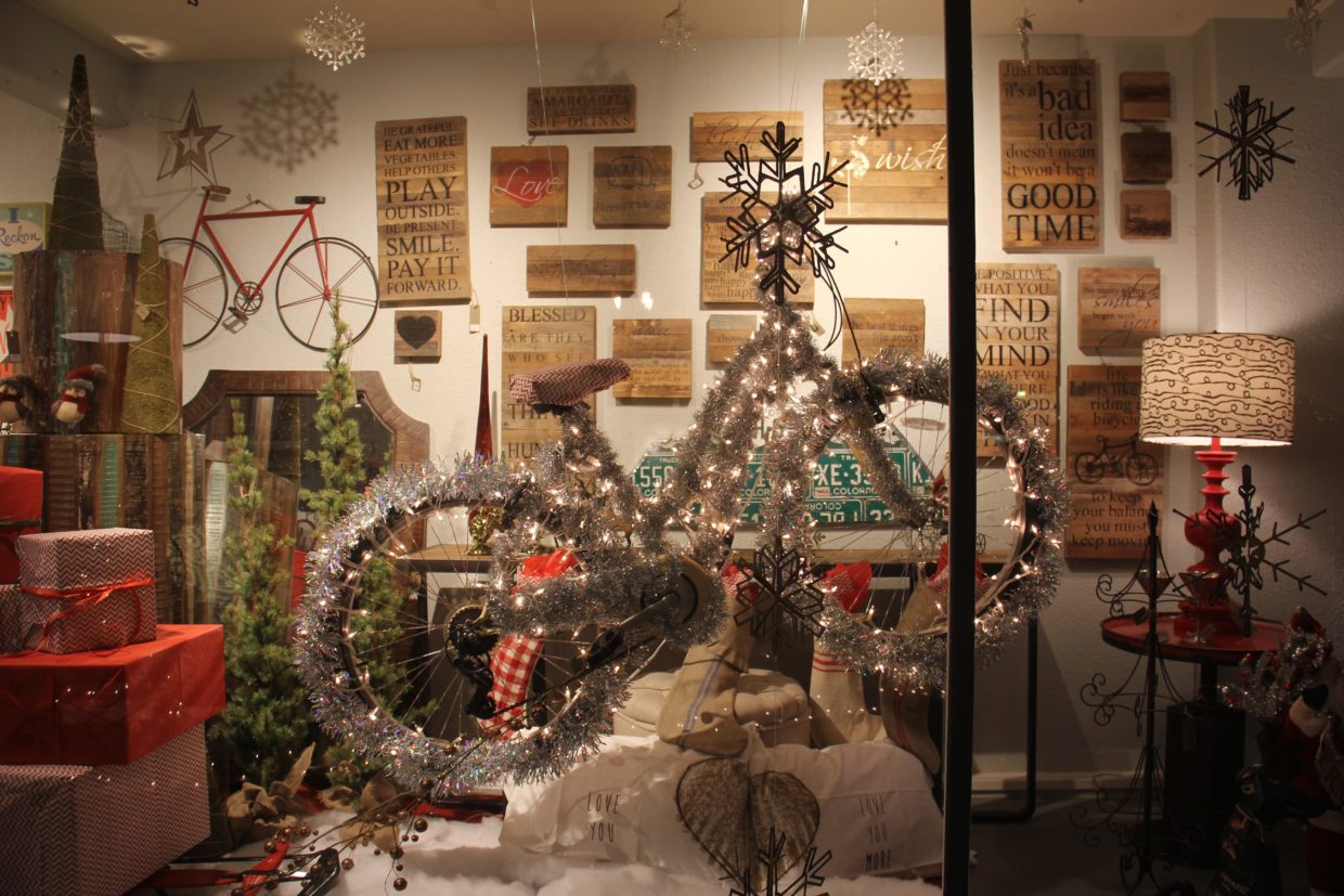 Christmas decorated bike in shop window.