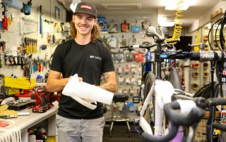 Man standing in bike shop