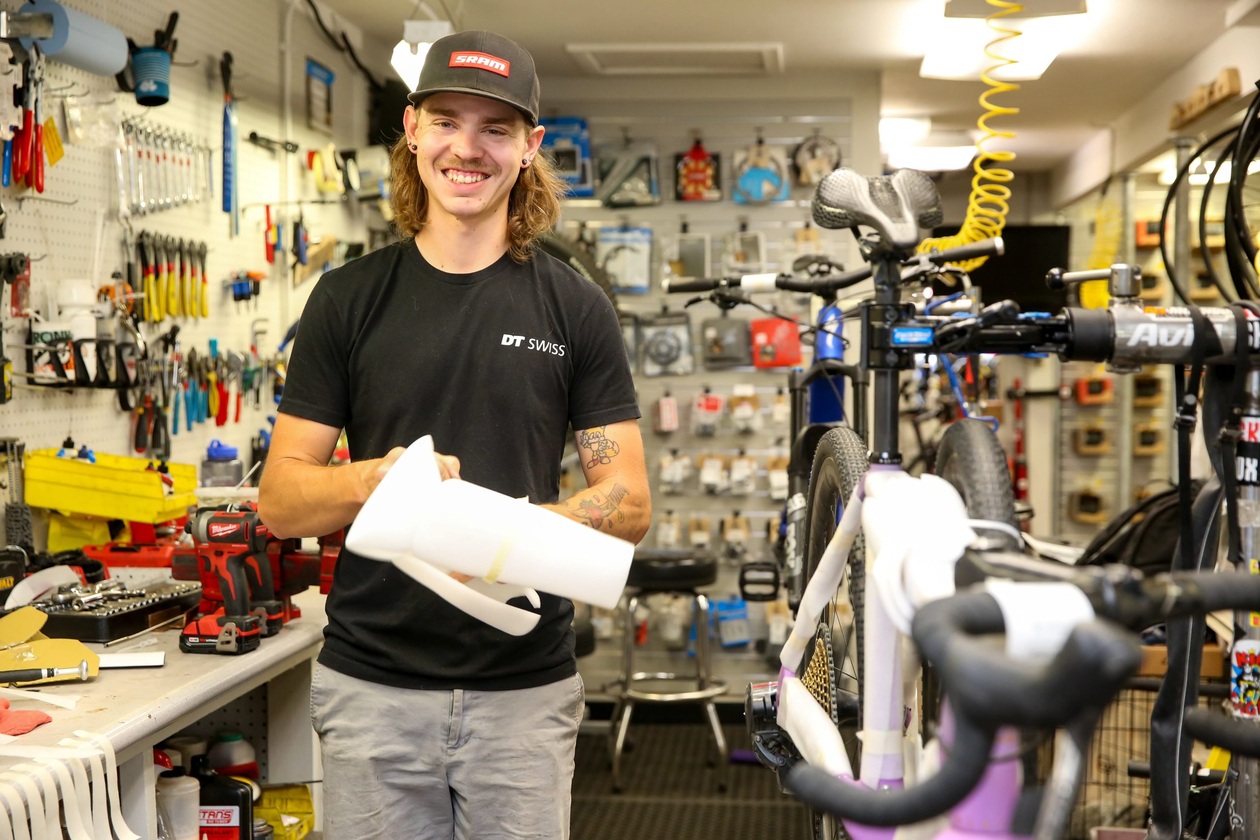 Man standing in bike shop